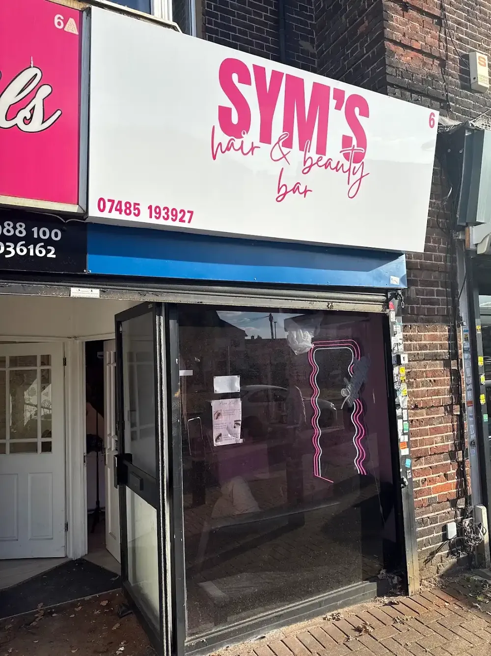 The SYM’S Hair and Beauty Bar shopfront on Becontree Avenue